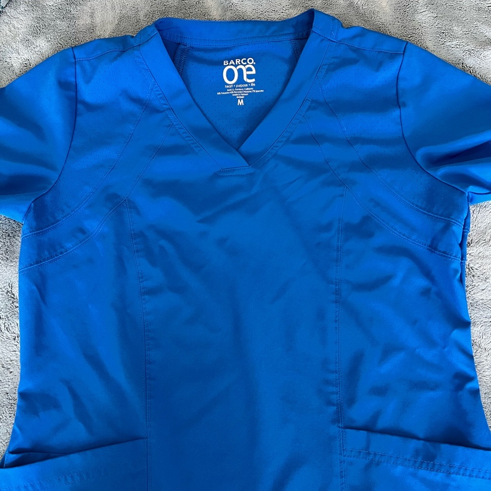 Barco One scrubs in New Royal. Top Medium Bottoms XSP.